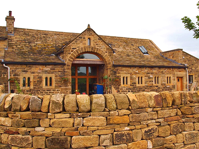 Completed barn conversion with stone wall at Eldwick, West Yorkshire by J and M Jeffery completed barn conversion with stone wall, eldwick, west yorkshire
