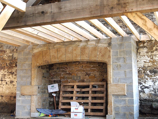 custom stonework fireplace by J & M Jeffery
